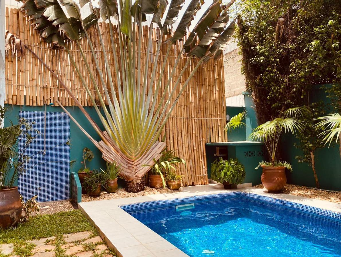 L'Oasis Guesthouse Cotonú Exterior foto